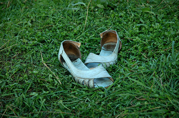 Photo of shoes in the wet grass